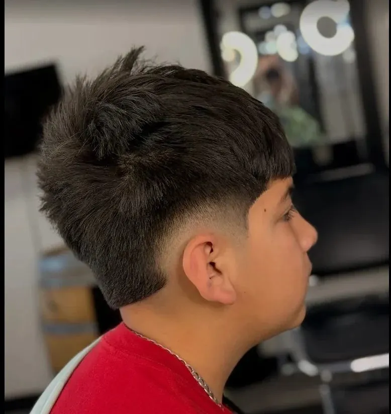 Textured top with a low taper, cut at Saloon Cuts