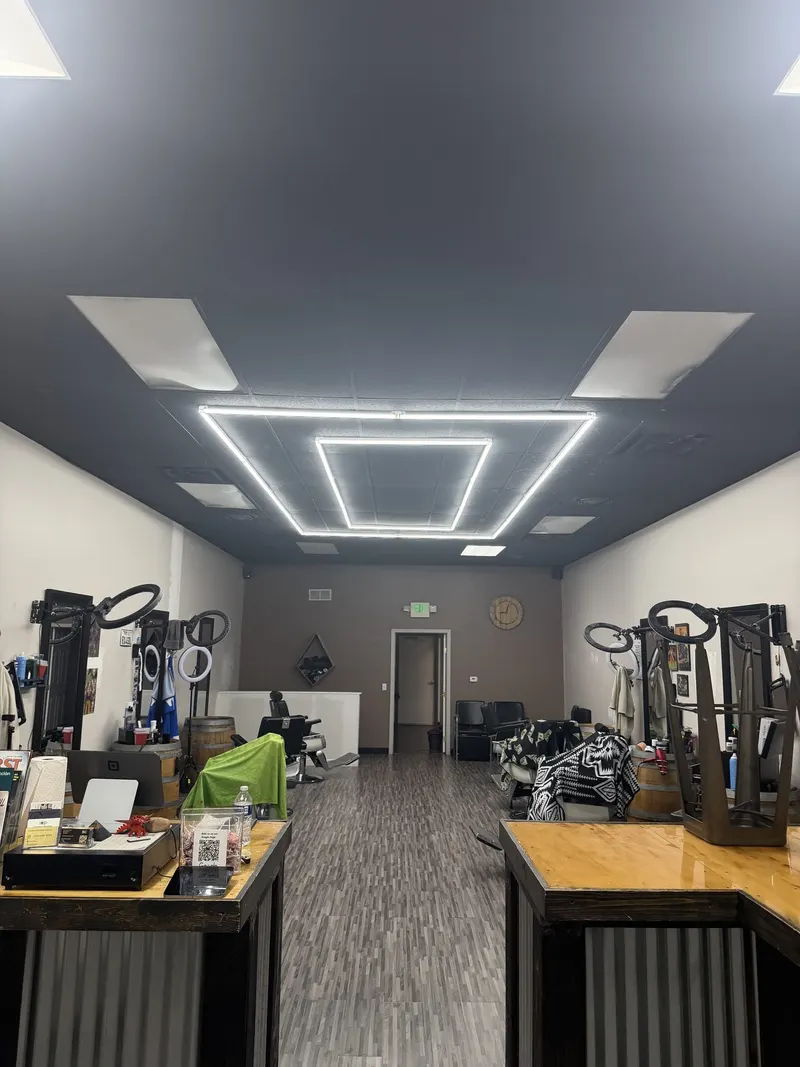 Inside Saloon Cuts in Broomfield: barber stations under the LED ceiling light