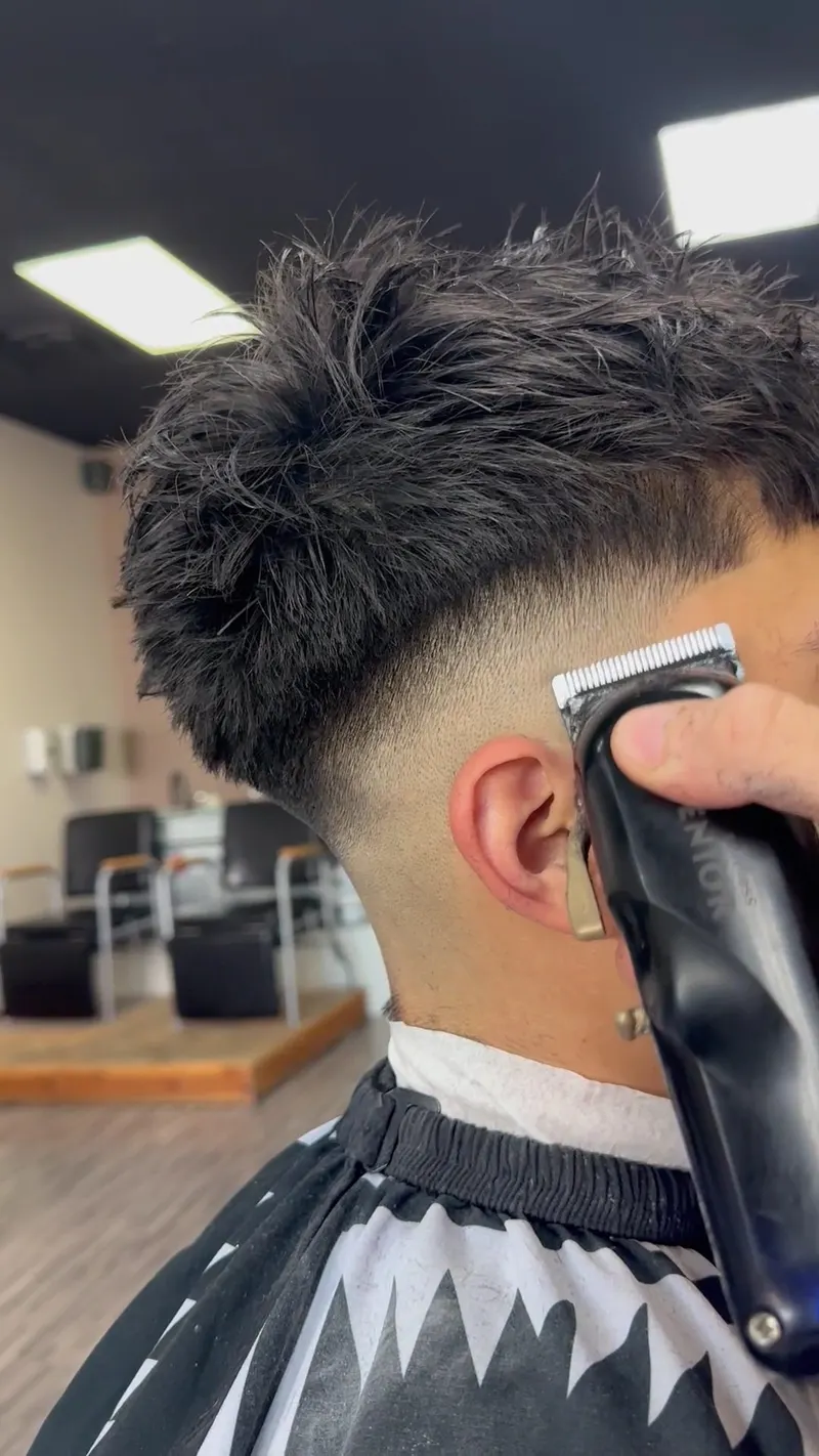Skin fade being finished with clippers at Saloon Cuts